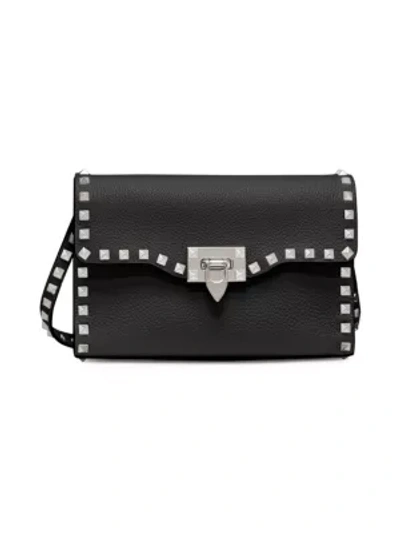 Shop Valentino Garavani Small Rockstud Leather Crossbody Bag In Nero