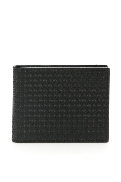 Shop Ferragamo Gancini Bi-fold Wallet In Nero (black)