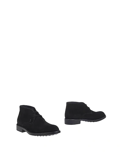 Shop Tod's Boots In Black