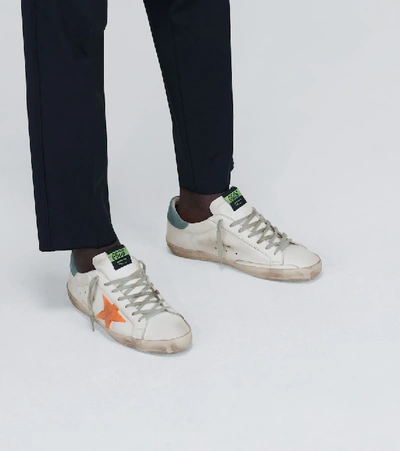 Shop Golden Goose Distressed Superstar Sneakers In White