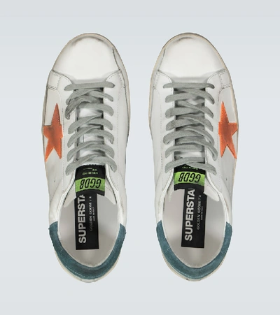 Shop Golden Goose Distressed Superstar Sneakers In White