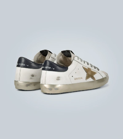 Shop Golden Goose Distressed Superstar Sneakers In White