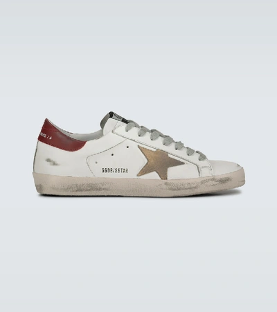 Shop Golden Goose Distressed Superstar Sneakers In White