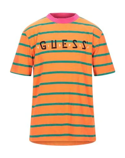 Shop Guess T-shirts In Orange
