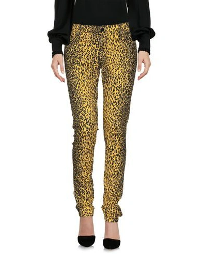Shop Guess Pants In Yellow