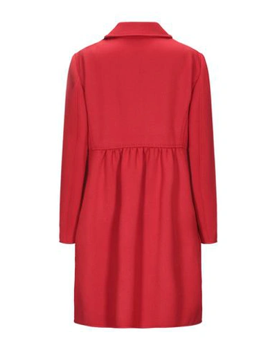 Shop Moschino Coat In Red