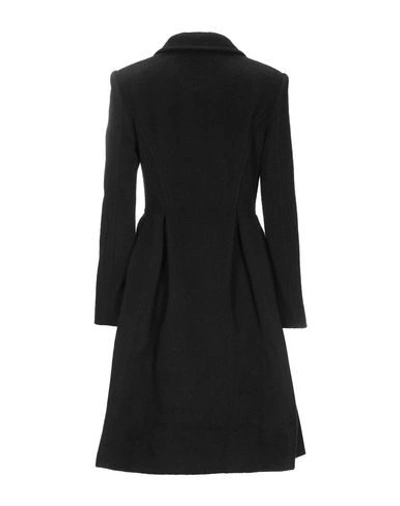 Shop Moschino Coats In Black