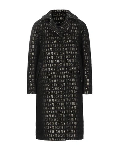 Shop Moschino Coats In Black