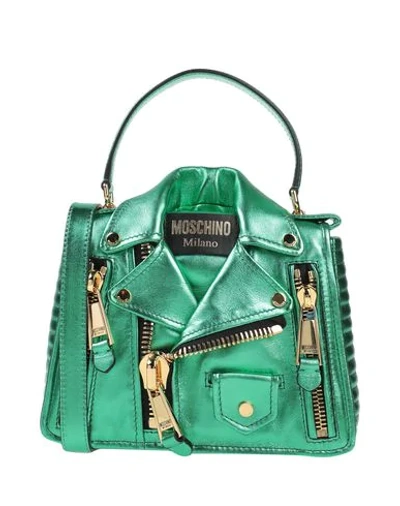 Shop Moschino Handbag In Green