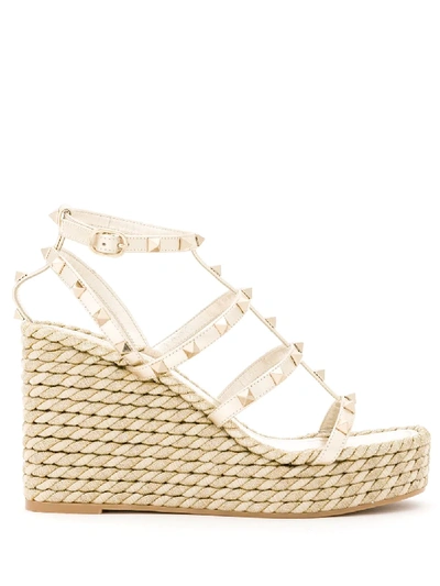 Shop Valentino Rockstud Wedge Sandals In Neutrals