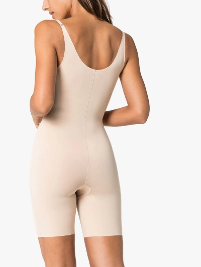 Shop Spanx Neutral Thinstincts Open Bust Mid-thigh Bodysuit In Neutrals