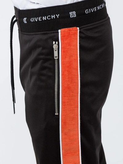 Shop Givenchy Elasticated Waist Trousers Black/orange