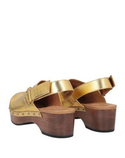 Shop Gucci Mules And Clogs In Gold