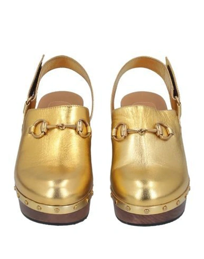 Shop Gucci Mules And Clogs In Gold