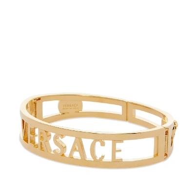 Shop Versace Cutout Bangle Bracelet In Gold