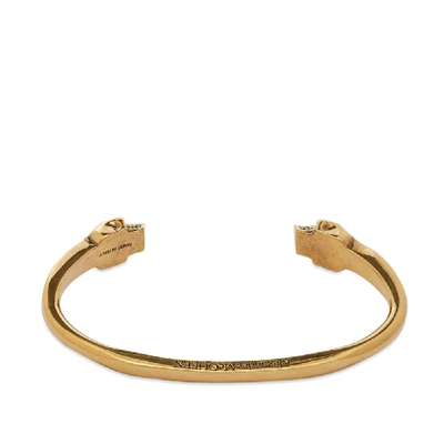 Shop Alexander Mcqueen Twin Skull Bracelet In Gold