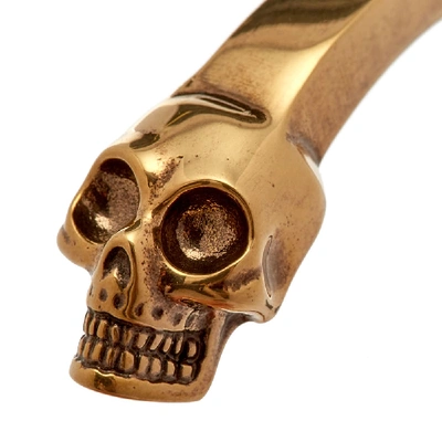 Shop Alexander Mcqueen Twin Skull Bracelet In Gold