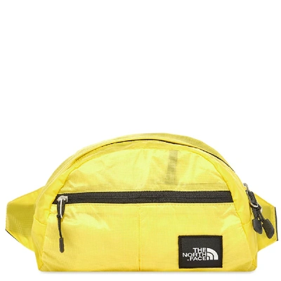 Shop The North Face Flyweight Lumbar Bag In Yellow