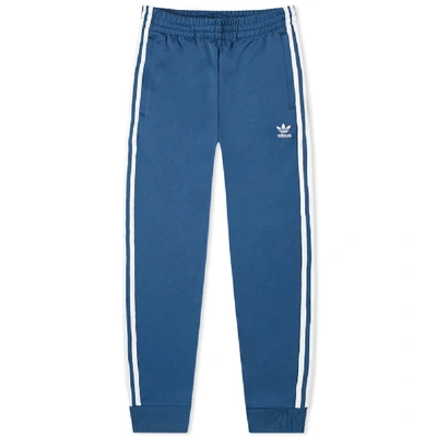 Shop Adidas Originals Adidas Superstar Track Pant In Blue