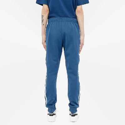 Shop Adidas Originals Adidas Superstar Track Pant In Blue