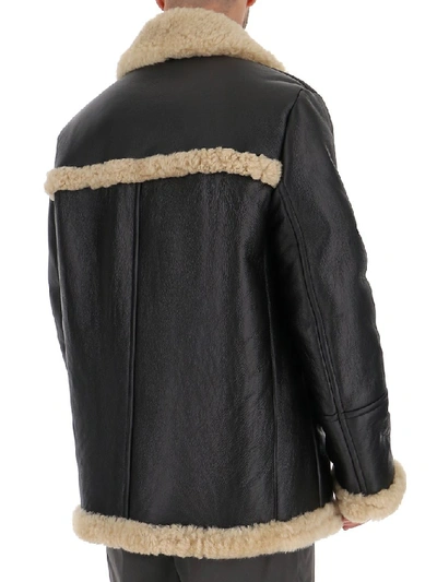 Shop Prada Shearling Trimmed Coat In Black