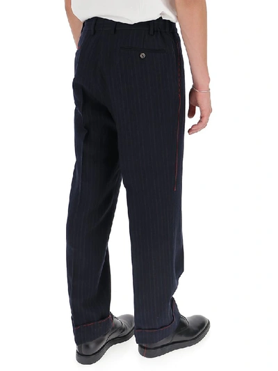 Shop Gucci Logo Patch Pinstriped Trousers In Blue