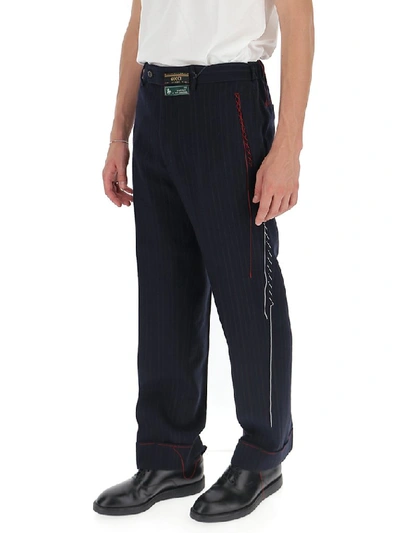 Shop Gucci Logo Patch Pinstriped Trousers In Blue