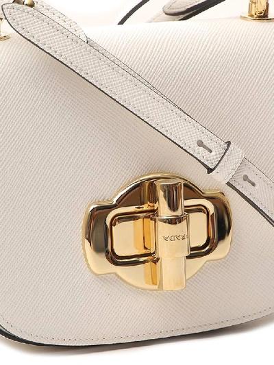 Shop Prada Lock Detail Shoulder Bag In White