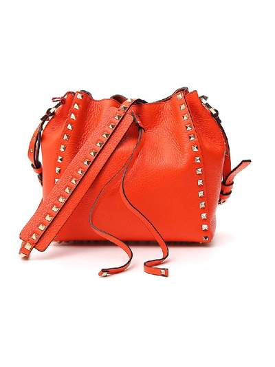 Shop Valentino Garavani Rockstud Bucket Bag In Orange