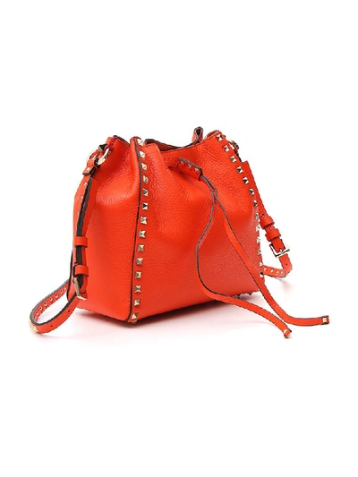 Shop Valentino Garavani Rockstud Bucket Bag In Orange