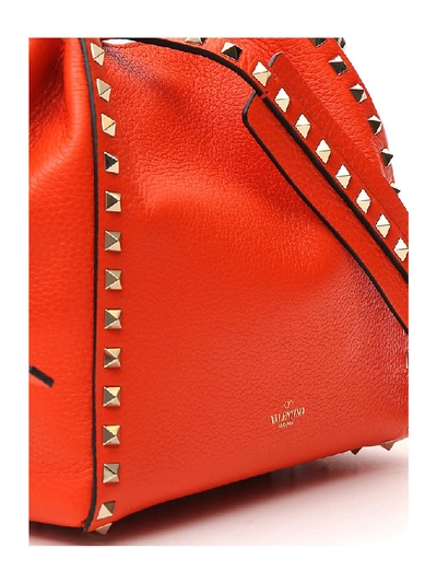 Shop Valentino Garavani Rockstud Bucket Bag In Orange