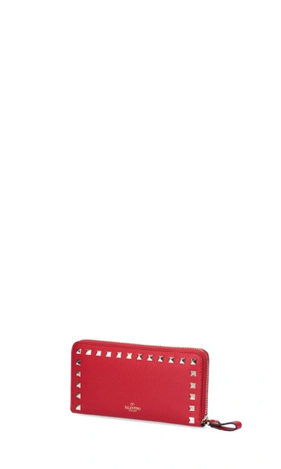 Shop Valentino Garavani Rockstud Zip Around Wallet In Red