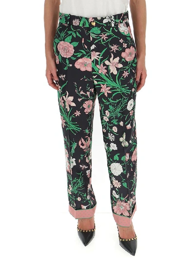 Shop Gucci Floral Printed Trousers In Multi