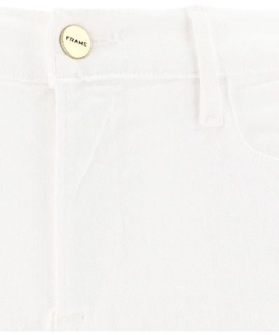 Shop Frame Le High Flare Jeans In White