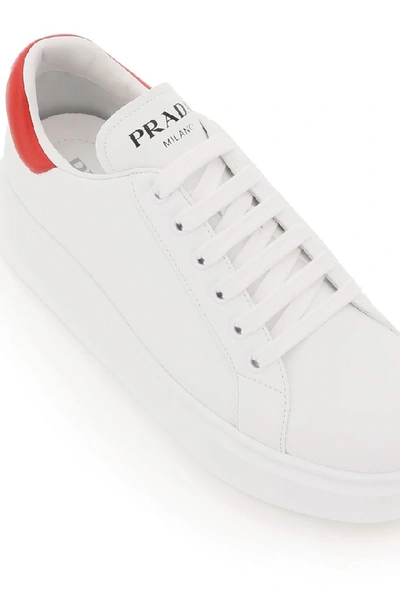 Shop Prada Logo Low Top Sneakers In White