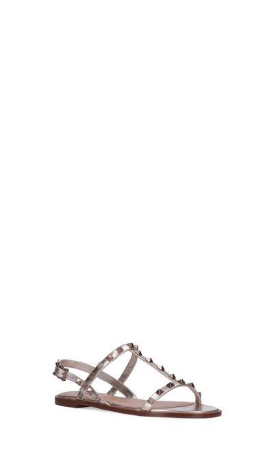 Shop Valentino Garavani Rockstud Sandals In Gold