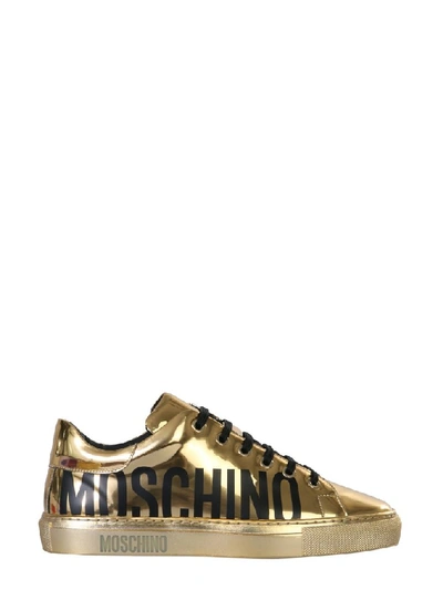 Shop Moschino Logo Sneakers In Gold