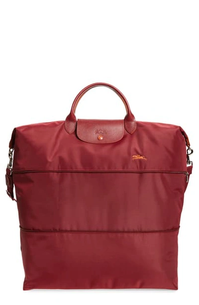 Shop Longchamp Le Pliage Club Expandable Travel Bag In Garnet Red