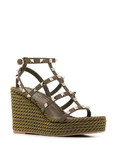 Shop Valentino Rockstud Rope Wedge Sandals In Green