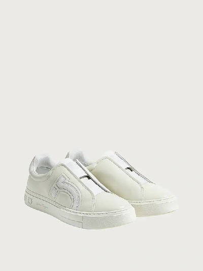 Shop Ferragamo Gancini Slip On Sneaker In White
