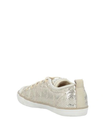 Shop Guess Sneakers In Gold