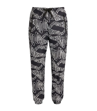 Shop Moschino All-over Logo Track Trousers