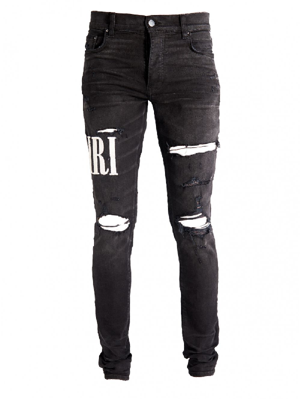 Amiri Distressed Embroidered Logo Jeans In Black | ModeSens