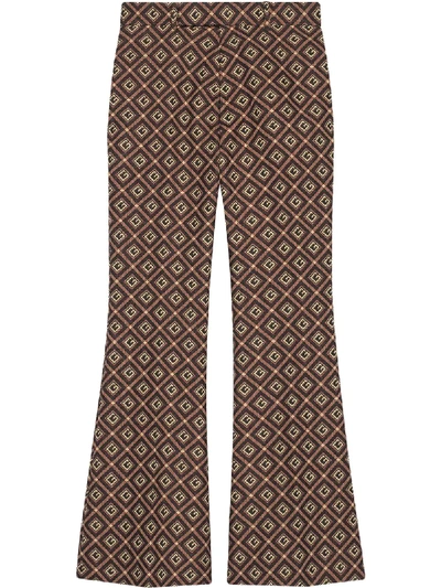 Shop Gucci Gg Damier Flared Trousers In Red
