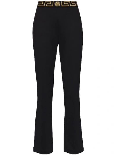Shop Versace Greca-border Flared Track Pants In Black