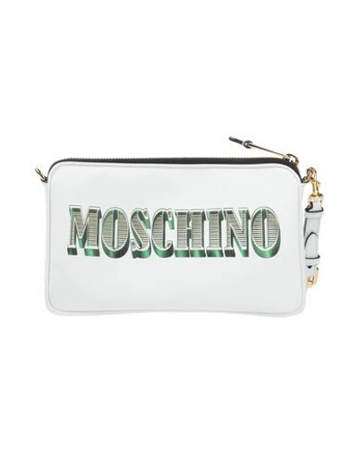 Shop Moschino Cross-body Bags In White