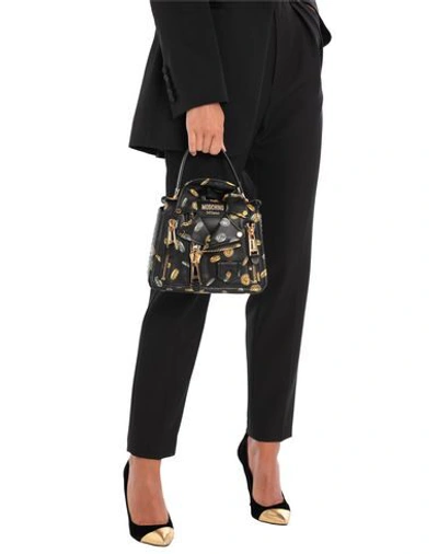 Shop Moschino Handbag In Black