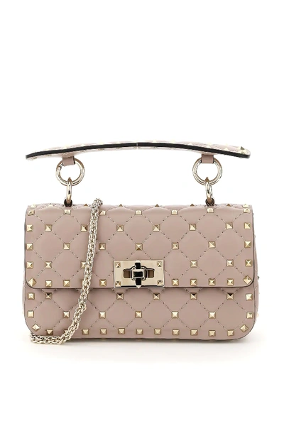 Shop Valentino Small Leather Rockstud Spike Bag In Pink,beige
