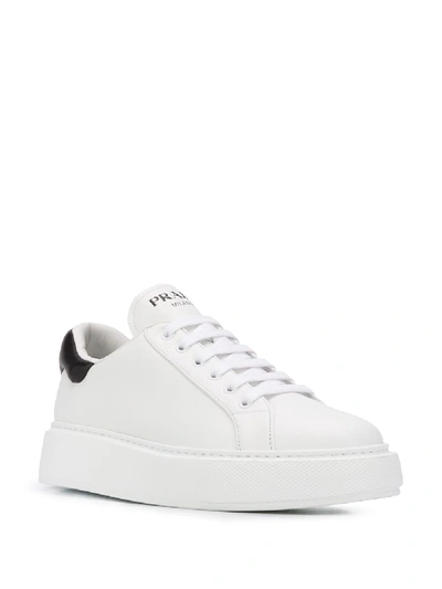 Shop Prada Leather Sneakers In White