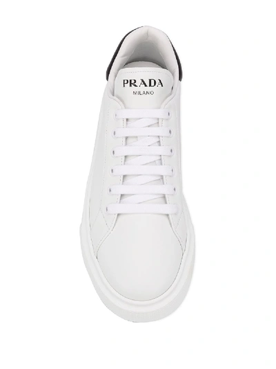 Shop Prada Leather Sneakers In White